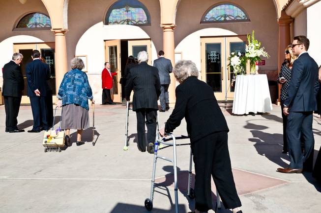Long-time friends and family arrive to pay their respects at the memorial mass for John Davis "Jackie" Gaughan held at St. Viator Catholic Church in Las Vegas on St. Patrick's Day, March 17, 2014.