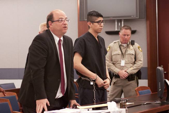 Cristian Diaz and his lawyer stand as Judge Jerome Tao announces Diaz’s sentence Monday, March 17, 2014. Diaz, 20, pleaded guilty last year to two counts of driving while under the influence of a controlled substance causing death and substantial bodily harm.