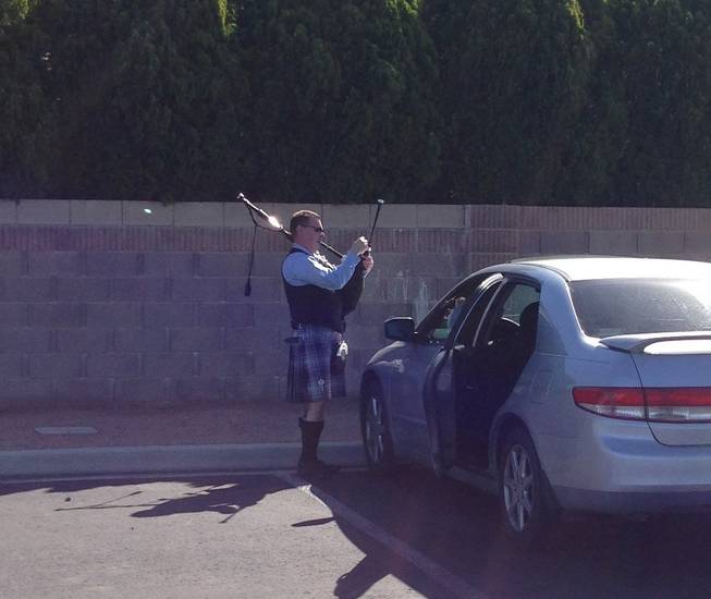 A bagpiper tunes his instrument before he plays during the funeral service of Las Vegas casino legend Jackie Gaughan at St. Viator Church on March 17, 2014.