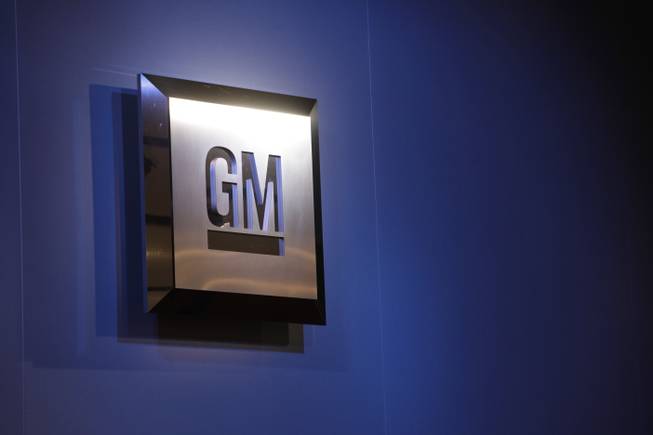 In this Jan. 12, 2009, file photo, the General Motors logo is on display at the North American International Auto Show in Detroit.