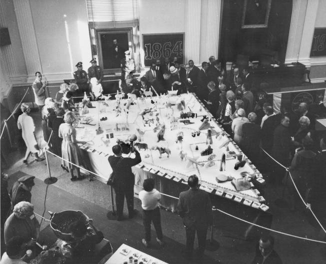 The cake celebrating Nevada's centennial in 1964 was assembled in the state Capitol and measured 21 feet long by 13 feet wide. It weighed about 1,300 pounds.