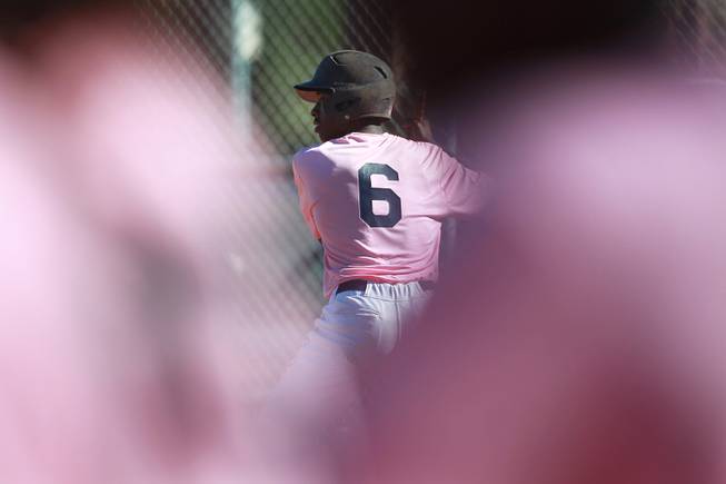 Canyon Springs hitter Rashaad Jones waits for a pitch during their game against Western Wednesday, March 19, 2014. The Pioneers wore pink jerseys for the game for cancer awareness and to honor parents of two of the players who died from cancer in the past year.