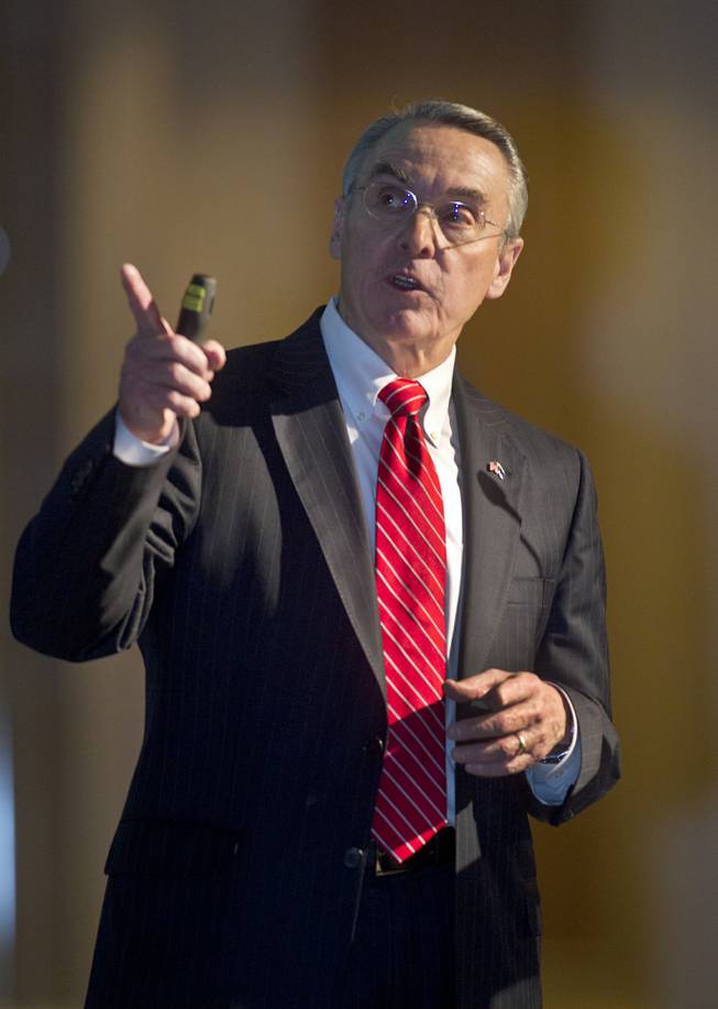 UNLV President Don Snyder explains a slide to the Las Vegas Metro Chamber of Commerce members at the Four Seasons Hotel on Wednesday, March 19, 2014.