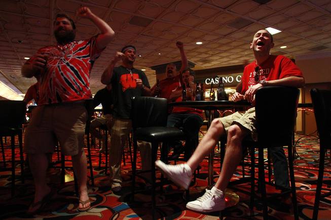 From left, Craig Zielsdorf, Dan Gilkerson, Tom Filla, Mike Berra and Neil Duda, all from Arcadia, Wis., watch Wisconsin's second round NCAA basketball tournament game Thursday, March 20, 2014 at the LVH.