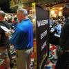Bettors stand in line to make their wagers at the LVH sports book during the second round of the NCAA basketball tournament Thursday, March 20, 2014.