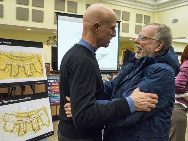 Architect Barry Svigals, left, greets Gene Rosen at a meeting to introduce proposed school designs, in Newtown Conn., Feb. 11, 2014. Svigals is founder of the firm Svigals + Partners, which designed the new Sandy Hook Elementary that will replace the building, now torn down, where Adam Lanza shot and killed 20 children and six adults.