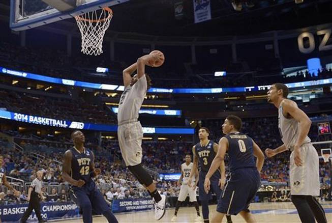 Colorado forward Xavier Johnson (2) dunks the ball during the second half in a second-round game against Pittsburgh in the NCAA college basketball tournament Thursday, March 20, 2014, in Orlando, Fla. 
