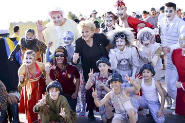 Las Vegas Mayor Carolyn Goodman poses with Cirque du Soleil performers during the Run Away with Cirque du Soleil 5K Run and One-Mile Fun Walk at the Springs Preserve on Saturday, March 15, 2014.