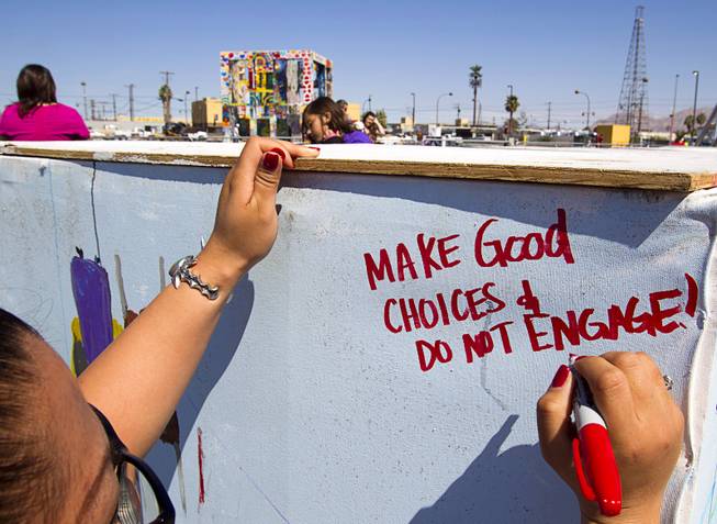 Edylynn Quijano writes on a cube before the burning of ...