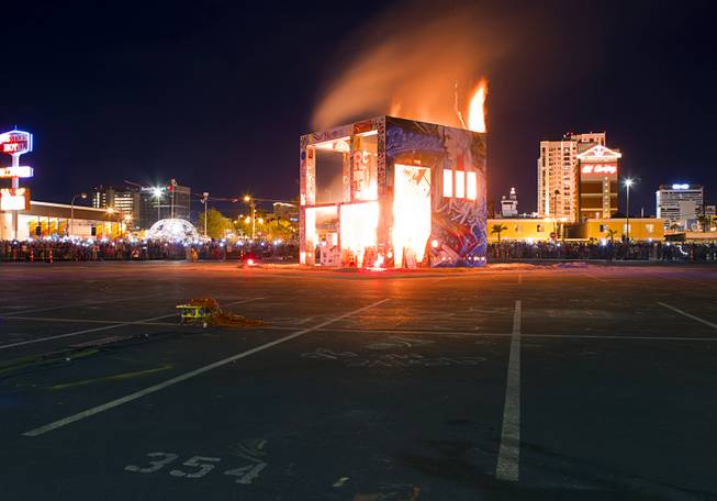 The Life Cube, an interactive community art installation, is burned in downtown Las Vegas, Friday March 21, 2014. The Life Cube, a creation of artist Scott Cohen, was a 24-by-24-foot plywood cube, painted by artists and filled with notes from thousands of people.
