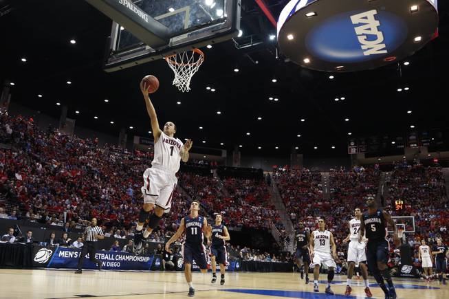 Arizona guard Gabe York scores a basket while playing Gonzaga during the first half of a third-round game in the NCAA college basketball tournament Sunday, March 23, 2014, in San Diego.

