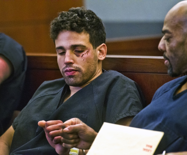 Joey Kadmiri, who is accused of trying to steal costumes from Thunder Down Under and then pulling a gun on the male revue's performers, shares a fist bump with another detainee after his arraignment at the Clark County Regional Justice Center on Monday, March 24, 2014.