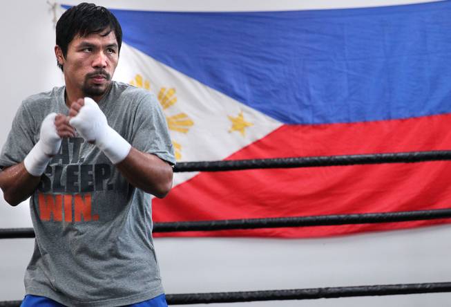 Manny Pacquiao works out at the Wild Card Boxing Club in Hollywood, Calif. during training Monday, March 24, 2014, for his eagerly-anticipated rematch against undefeated WBO World Welterweight champion Timothy Bradley.  .
