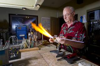 Glass artist Craig Reeves works on a project at his studio in North Las Vegas Tuesday, March 25, 2014. Reeves will be exhibiting at the Glass Craft Expo which runs Wednesday through Sunday at the South Point.