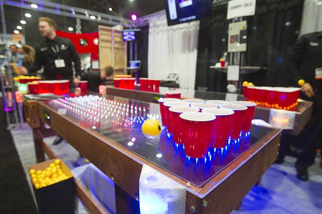 LED beer pong tables by Penumbra Tables are displayed during the Nightclub & Bar Convention and Trade Show at the Las Vegas Convention Center Wednesday March 26, 2014.