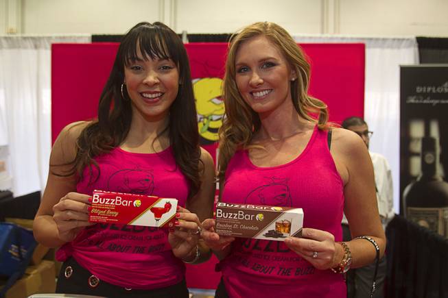 Tala Marie, left, and Stacey Kane display Buzz Bars, alcohol-infused ice cream bars, during the Nightclub & Bar Convention and Trade Show at the Las Vegas Convention Center Wednesday March 26, 2014.