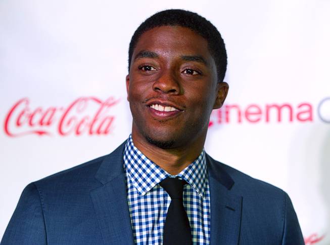 Actor Chadwick Boseman, recipient of the Male Star of Tomorrow award, arrives for the Big Screen Achievement Awards during CinemaCon, the official convention of the National Association of Theatre Owners, at Caesars Palace Thursday, March 27, 2014.