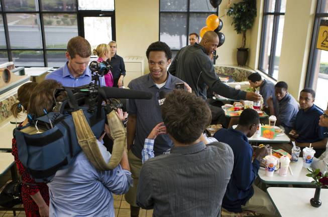 Findlay Prep guard Rashad Vaughn is interviewed by members of the media while dining with teammates at a local McDonald's on Thursday, March 27, 2014.  He is the star of UNLV basketball's 2014 recruiting class and now honored as a McDonald's All-American.