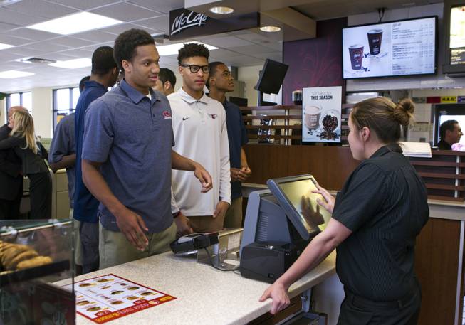 Findlay Prep guard Rashad Vaughn orders food with teammates while dining at a local McDonald's as he is honored for being selected as a McDonald's All-American on Thursday, March 27, 2014.
