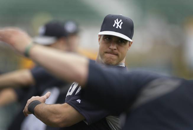 New York Yankees first baseman Mark Teixeira stretches before batting practice of a spring exhibition baseball game against the Pittsburgh Pirates in Bradenton, Fla., Monday, March 17, 2014.