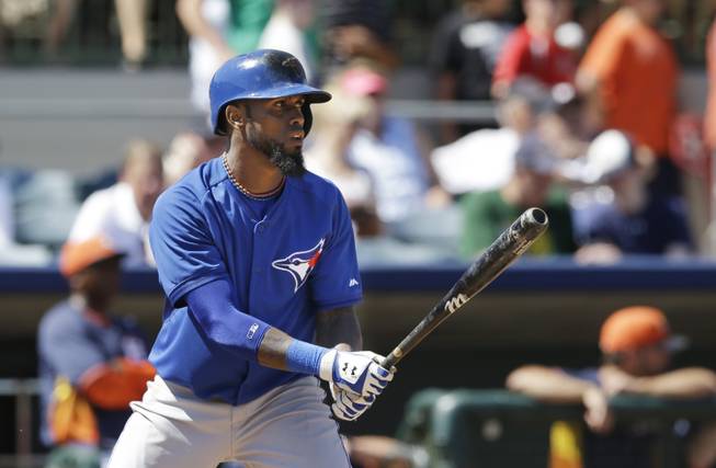 Toronto Blue Jays' Jose Reyes bats during a spring training baseball game against the Houston Astros in Kissimmee, Fla., Sunday, March 9, 2014