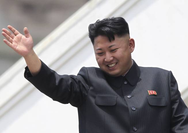 In this July 27, 2013, file photo, North Korean leader Kim Jong Un waves to war veterans during a mass military parade celebrating the 60th anniversary of the Korean War armistice in Pyongyang, North Korea. Despite thinly sourced reports that an order went out in mid-March 2014 for university students to buzz cut the sides of their heads just like North Korea’s supreme leader, recent visitors to the country say they haven’t seen evidence of any mass haircutting.