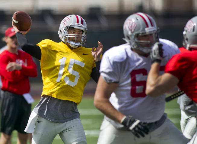 UNLV QB Jarin Morikawa eyes a receiver during practice at Rebel Park on Friday, March 28, 2014.
