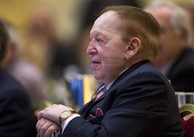Sheldon Adelson, chairman of the board and CEO of Las Vegas Sands Corp., listens to New Jersey Gov. Chris Christie during the Republican Jewish Coalition Spring Leadership Meeting at the Venetian on Saturday, March 29, 2014.