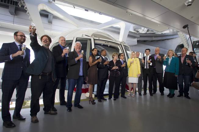 Special guests, executives and elected officials toast before the first official ride on the 550-foot-tall High Roller observation wheel Monday, March 31, 2014. The observation wheel, the tallest in the world, is part of the Linq project, a $550 million development by Caesars Entertainment Corp.
