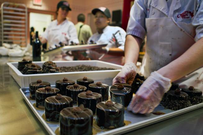 Fresh chocolate mousse are prepared in the kitchen at the new Carlo's Bakery in the Venetian celebrating their grand opening on Monday, March 31, 2014.