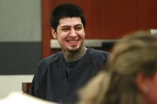 Peter Andrade Jr. smiles before his preliminary hearing on attempted murder and other charges Tuesday, April 1, 2014.
