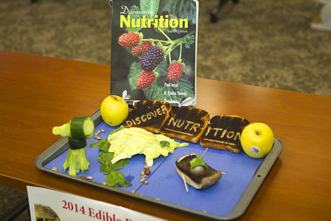 A creation by Jose Romo is displayed during the 2014 Edible Book Festival at the UNLV Lied Library Tuesday, April 1, 2014. The work is inspired by "Discovering Nutrition," a textbook by Paul Insel and others. The work won for the Best Entry Food-related or Cookbook Category.