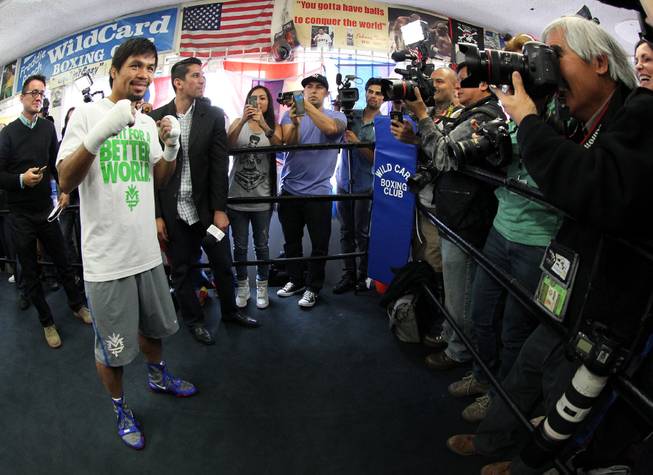 Manny Pacquiao poses for photographers during media day at the Wild Card Boxing Club in Hollywood, Calif. Wednesday, April 2, 2014 for his eagerly-anticipated rematch against undefeated WBO World Welterweight  champion Timothy Bradley.