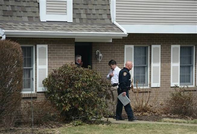 Police investigate at the scene Tuesday, April 1, 2014, where two children, Daniel Schlemmer, 6 and Luke Schlemmer, 3, were found unresponsive in a bathtub at a home in McCandless, Pa. The mother Laurel Michelle Schlemmer, 40, was jailed without bond after she was arraigned early Wednesday, April 2, 2104, on charges including criminal homicide, aggravated assault and child endangerment.