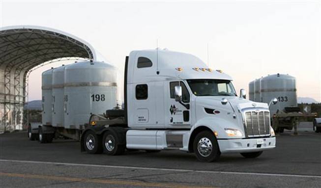 A truck hauls a shipment of nuclear waste from Los Alamos National Laboratory in Los Alamos, N.M., April 2, 2014. 