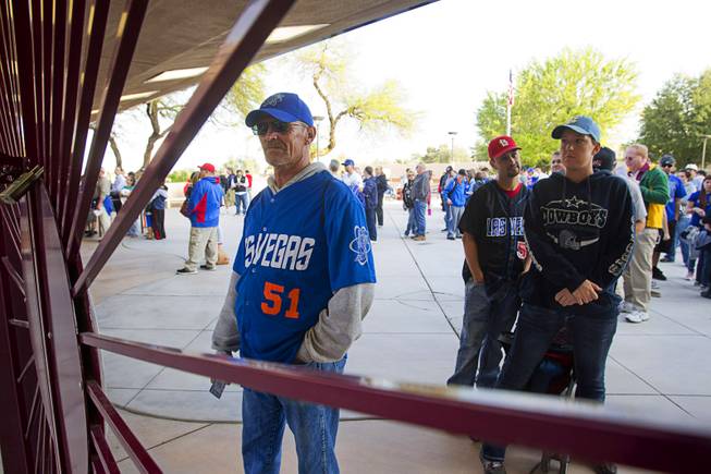 Fans, including, Jim Brandon, left, wait for the gates to open for the Las Vegas 51's season opener against the Fresno Grizzlies Thursday, April 3, 2014.