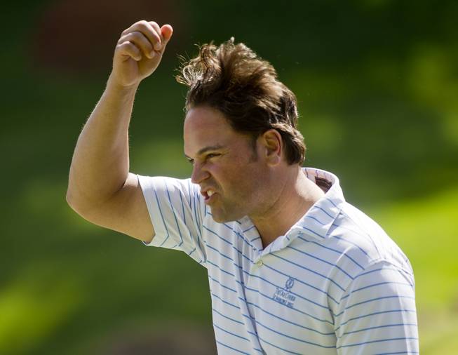 Former MLB player Mike Piazza reacts to his team's performance during opening day play of the Michael Jordan Celebrity Invitational at Shadow Creek Golf Course on Thursday, April 3, 2014.