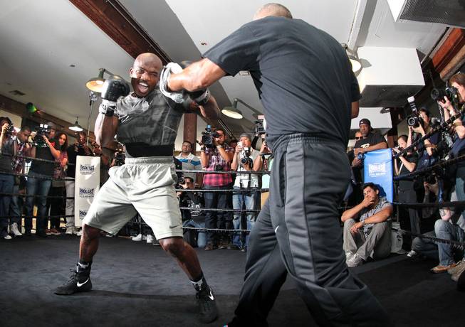 Undefeated WBO World Welterweight champion Timothy Bradley hits the mitts with trainer Joel Diaz during media day during media day Thursday, April 3, 2014 at Fortune Gym in Hollywood, Calif. for his eagerly-anticipated rematch against superstar Manny Pacquiao.