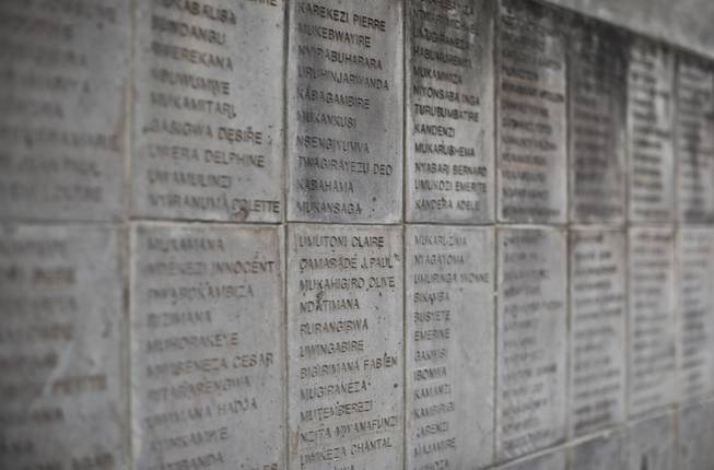 The names of some of those who were slaughtered as they sought refuge inside the church are inscribed on a stone memorial outside to the thousands who were killed in and around the Catholic church during the 1994 genocide in Ntarama, Rwanda, Friday, April 4, 2014.