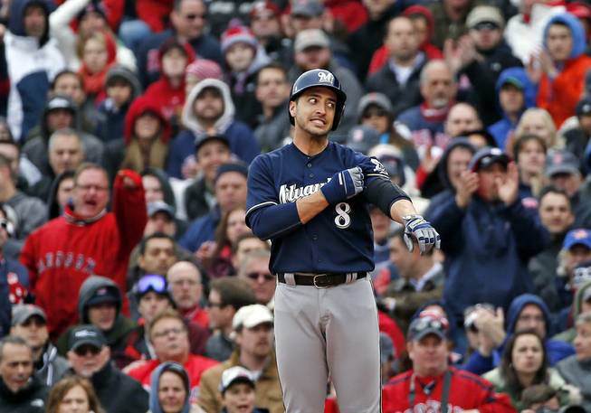 Milwaukee Brewers' Ryan Braun (8) pauses at first base after grounding out in the seventh inning of a baseball game against the Boston Red Sox at Fenway Park on Friday, April 4, 2014, in Boston.