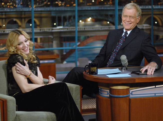 In this Jan. 11, 2006, file photo released by CBS, Madonna joins host David Letterman on the set of "The Late Show With David Letterman" in New York.