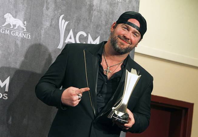 Lee Brice poses in the photo room during the 49th Academy of Country Music Awards at the MGM Grand Garden Arena Sunday, April 6, 2014. Brice won the Song of the Year award for the song "I Drive Your Truck".