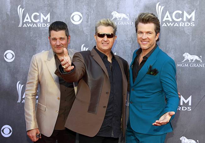  Jay DeMarcus, Gary LeVox and Joe Don Rooney of Rascal Flatts arrive for the 49th Academy of Country Music Awards on Sunday, April 6, 2014, at MGM Grand Garden Arena in Las Vegas.