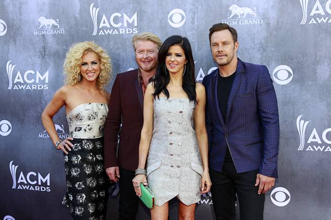 Members of Little Big Town, from left, Kimberly Schlapman, Philip Sweet, Karen Fairchild, and Jimi Westbrook, arrive for the 49th Academy of Country Music Awards show at the MGM Grand Garden Arena Sunday, April 6, 2014.
