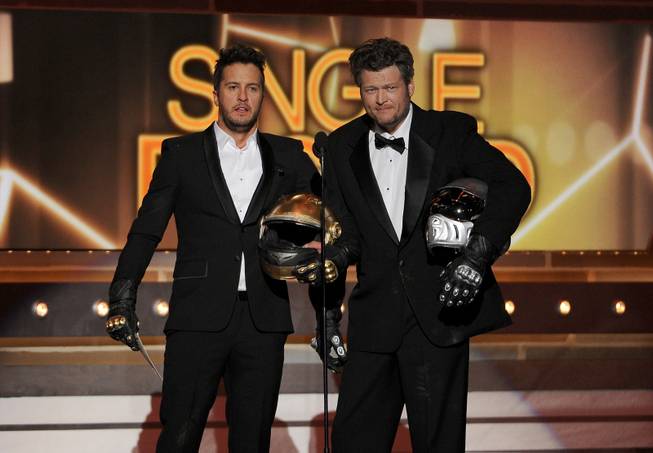 Hosts Luke Bryan and Blake Shelton speak onstage at the 49th annual Academy of Country Music Awards on Sunday, April 6, 2014, at MGM Grand Garden Arena.