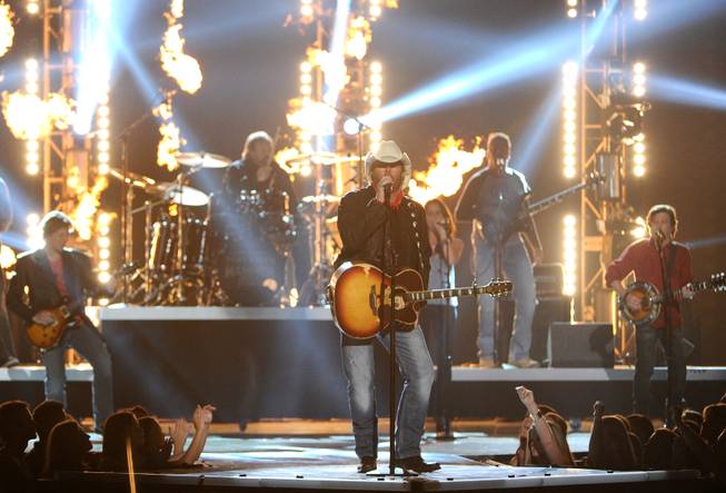 Toby Keith performs on stage at the 49th annual Academy of Country Music Awards at the MGM Grand Garden Arena on Sunday, April 6, 2014, in Las Vegas. 