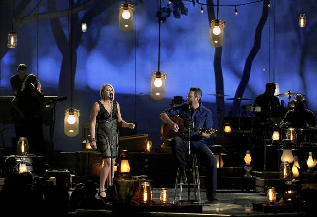 Gwen Sebastian and Blake Shelton perform onstage at the 49th Annual Academy of Country Music Awards at MGM Grand Garden Arena on Sunday, April 6, 2014, in Las Vegas.