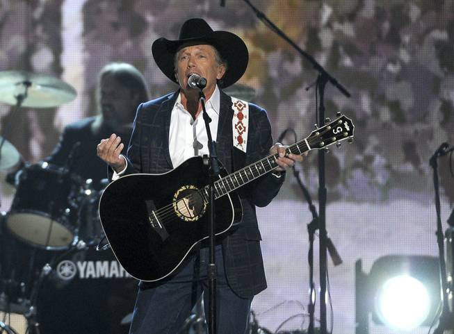 George Strait performs onstage at the 49th Annual Academy of Country Music Awards at MGM Grand Garden Arena on Sunday, April 6, 2014, in Las Vegas.