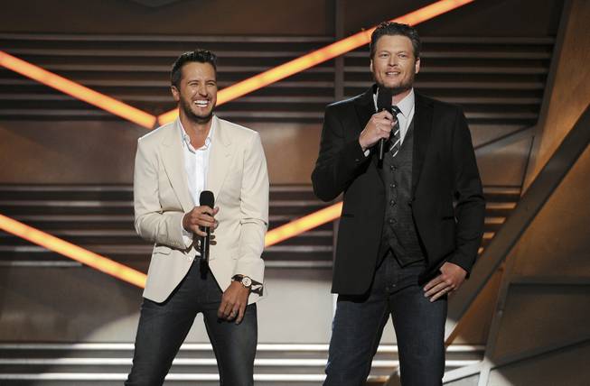 Hosts Luke Bryan and Blake Shelton speak onstage at the 49th Annual Academy of Country Music Awards at MGM Grand Garden Arena on Sunday, April 6, 2014, in Las Vegas.