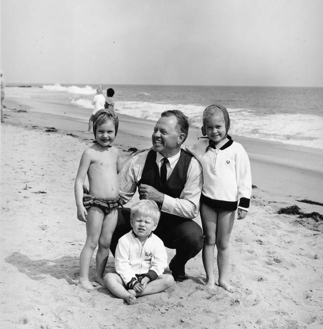 Actor Mickey Rooney is pictured with his children at a beach location in this undated photograph. From left are: daughter Kerry, 4, son Kyle, 3, and 5-year-old daughter Kelly, 5.